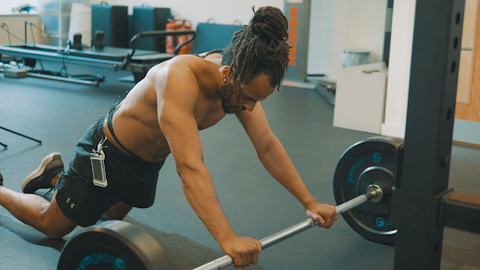A person using the mitouch device while exercising